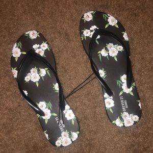 Black floral flip flops